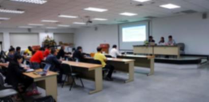 Blurred of people training in room with three instructors, listener and projector. Seminar and workshop. Group of personal study and learning in classroom. Blur focus concept photo