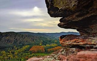 Interesting colored sandstone formations with nice view on the forest photo