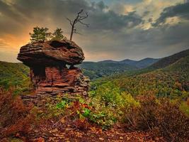 Interesting colored sandstone formations with nice view on the forest photo