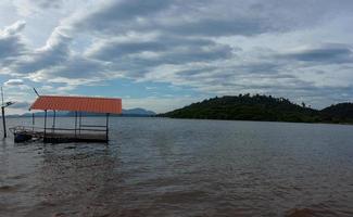 Old raft in the middle of the water In Si Yat Reservoir, Tha Takiab District, Chachoengsao Province, Thailand photo