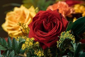 Funeral flowers presented upon a coffin at the event of someone's passing close-up photo