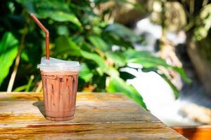 iced chocolate milkshake on table photo