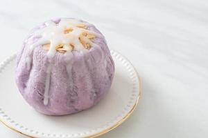 taro bun with white sugar cream and nut photo