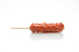 fried sausage skewer on white background photo