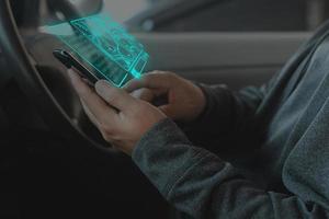 Man searching destination direction or address on GPS or navigator application via mobilephone photo