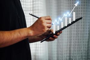 Businessman hands working with new modern computers and business strategies as concepts. photo