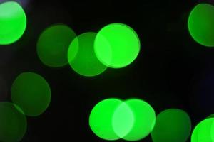 Abstract bokeh light green in the night for background. photo