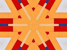 A colorful brick kaleidoscope background. Symmetric abstract and aesthetic pattern photo