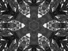 Black silver metalic kaleidoscope background. Abstract and symmetric pattern with dark vibes. photo