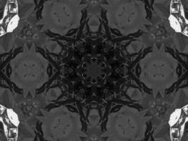 Black silver metalic kaleidoscope background. Abstract and symmetric pattern with dark vibes. photo