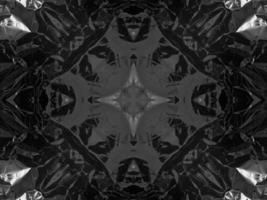 Black silver metalic kaleidoscope background. Abstract and symmetric pattern with dark vibes. photo
