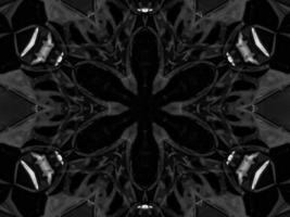 Black silver metalic kaleidoscope background. Abstract and symmetric pattern with dark vibes. photo