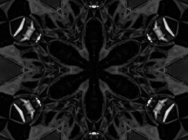 Black silver metalic kaleidoscope background. Abstract and symmetric pattern with dark vibes. photo