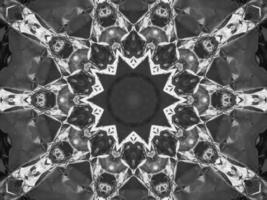 Black silver metalic kaleidoscope background. Abstract and symmetric pattern with dark vibes. photo
