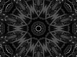 Black silver metalic kaleidoscope background. Abstract and symmetric pattern with dark vibes. photo
