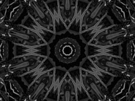 Black silver metalic kaleidoscope background. Abstract and symmetric pattern with dark vibes. photo