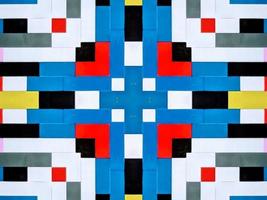 A colorful brick kaleidoscope background. Symmetric abstract and aesthetic pattern photo