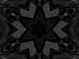 fondo de caleidoscopio metálico plateado negro. patrón abstracto y simétrico con vibraciones oscuras. foto