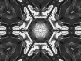 Black silver metalic kaleidoscope background. Abstract and symmetric pattern with dark vibes. photo