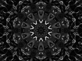 Black silver metalic kaleidoscope background. Abstract and symmetric pattern with dark vibes. photo