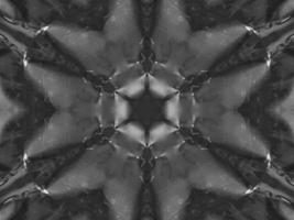 Black silver metalic kaleidoscope background. Abstract and symmetric pattern with dark vibes. photo