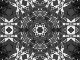 Black silver metalic kaleidoscope background. Abstract and symmetric pattern with dark vibes. photo