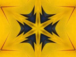 Yellow feather kaleidoscope floral pattern with some blue and red color. Abstract unique and aesthetic background. photo