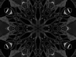 Black silver metalic kaleidoscope background. Abstract and symmetric pattern with dark vibes. photo