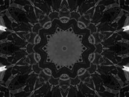 Black silver metalic kaleidoscope background. Abstract and symmetric pattern with dark vibes. photo