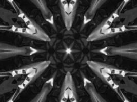 Black silver metalic kaleidoscope background. Abstract and symmetric pattern with dark vibes. photo