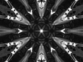 Black silver metalic kaleidoscope background. Abstract and symmetric pattern with dark vibes. photo