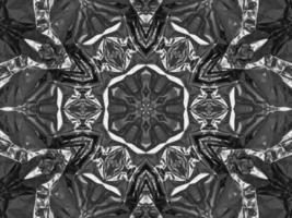 Black silver metalic kaleidoscope background. Abstract and symmetric pattern with dark vibes. photo