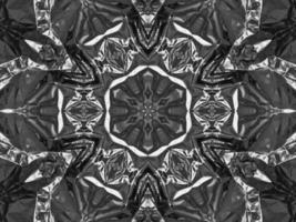 Black silver metalic kaleidoscope background. Abstract and symmetric pattern with dark vibes. photo