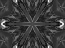 Black silver metalic kaleidoscope background. Abstract and symmetric pattern with dark vibes. photo