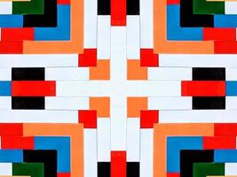 A colorful brick kaleidoscope background. Symmetric abstract and aesthetic pattern photo