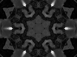 Black silver metalic kaleidoscope background. Abstract and symmetric pattern with dark vibes. photo