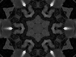 Black silver metalic kaleidoscope background. Abstract and symmetric pattern with dark vibes. photo