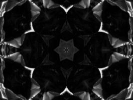 Black silver metalic kaleidoscope background. Abstract and symmetric pattern with dark vibes. photo