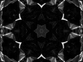 Black silver metalic kaleidoscope background. Abstract and symmetric pattern with dark vibes. photo