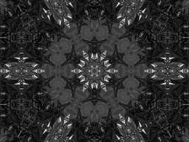 Black silver metalic kaleidoscope background. Abstract and symmetric pattern with dark vibes. photo