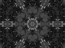 Black silver metalic kaleidoscope background. Abstract and symmetric pattern with dark vibes. photo