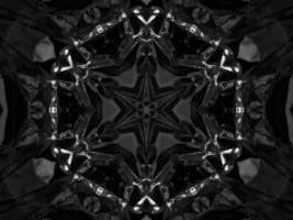 Black silver metalic kaleidoscope background. Abstract and symmetric pattern with dark vibes. photo