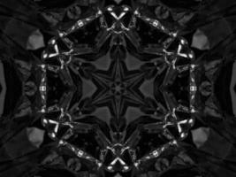 Black silver metalic kaleidoscope background. Abstract and symmetric pattern with dark vibes. photo