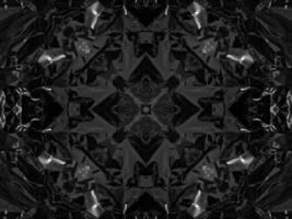 Black silver metalic kaleidoscope background. Abstract and symmetric pattern with dark vibes. photo