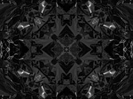 Black silver metalic kaleidoscope background. Abstract and symmetric pattern with dark vibes. photo