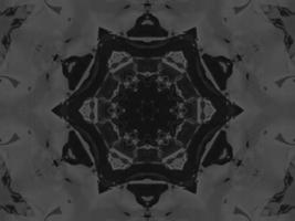 Black silver metalic kaleidoscope background. Abstract and symmetric pattern with dark vibes. photo
