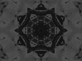 Black silver metalic kaleidoscope background. Abstract and symmetric pattern with dark vibes. photo