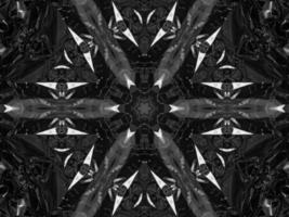 Black silver metalic kaleidoscope background. Abstract and symmetric pattern with dark vibes. photo