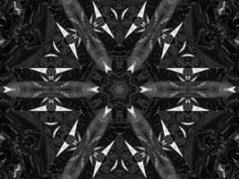 Black silver metalic kaleidoscope background. Abstract and symmetric pattern with dark vibes. photo