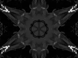 Black silver metalic kaleidoscope background. Abstract and symmetric pattern with dark vibes. photo